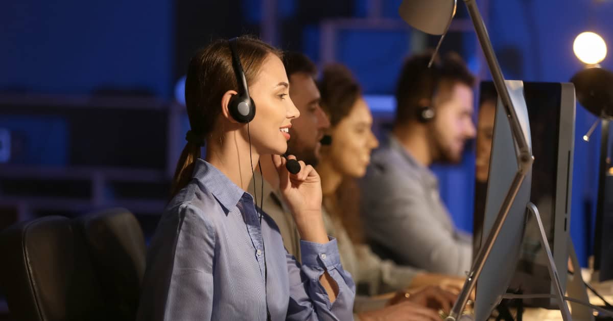 Cyber Threat Management Security Operations Centre (SOC) team monitoring cyber threats in real-time across multiple screens in a high-tech control room